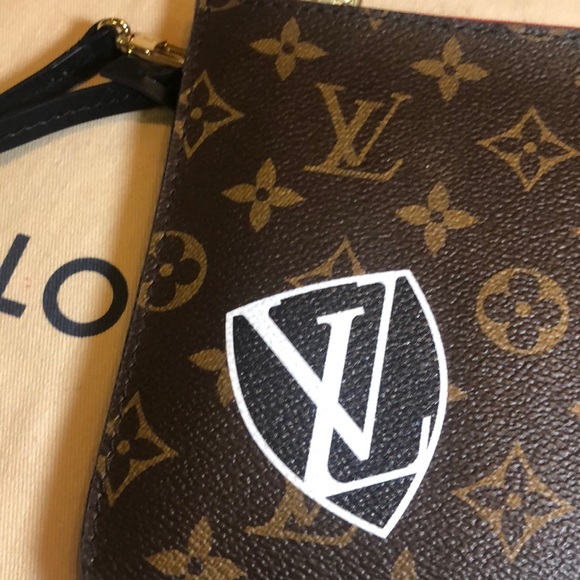 LV wristlet from World Tour collection. Authentic